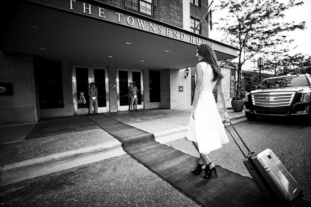 woman pulling luggage