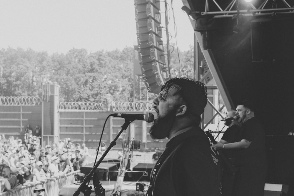 man singing on stage