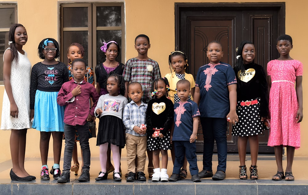 children standing near house