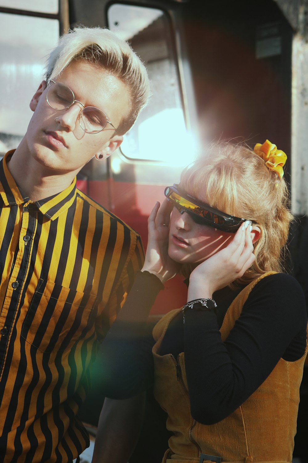 woman and man wearing yellow-and-black shirts