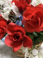 A vibrant bouquet of mixed flowers arranged in a rustic basket.