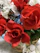 A vibrant bouquet of mixed flowers arranged beautifully in a rustic basket, perfect for Mother's Day.