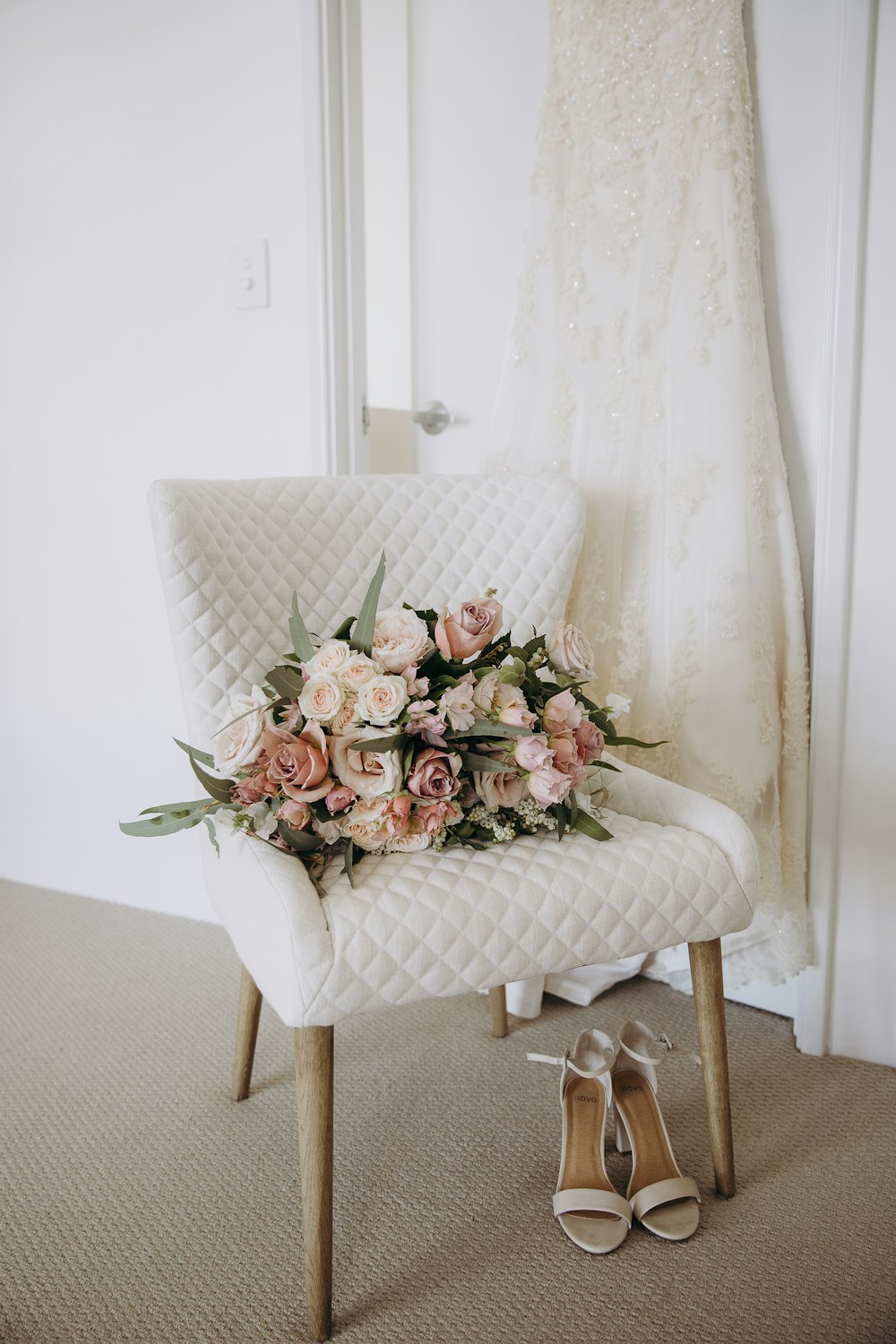 flowers on white padded chair