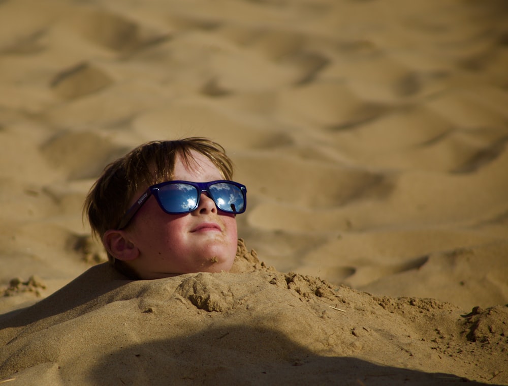 boy lying on shore