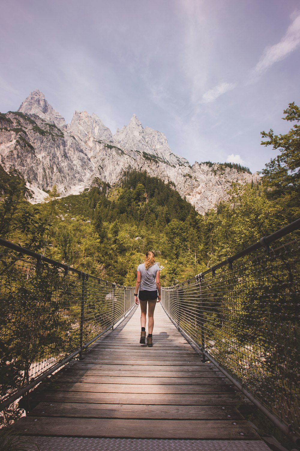 woman walking on bridge