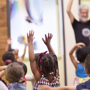 children lifting hands