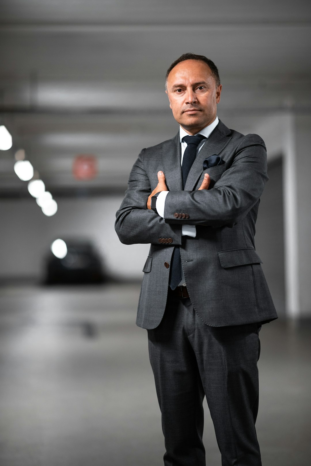 Man in suit with arms crossed