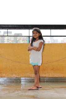 Mafalda standing confidently with her arms crossed, ready to share her thoughts.