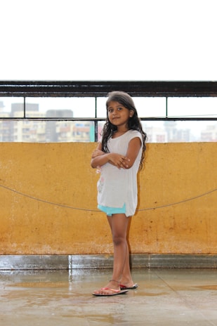 Mafalda standing confidently with her arms crossed, ready to share her thoughts.