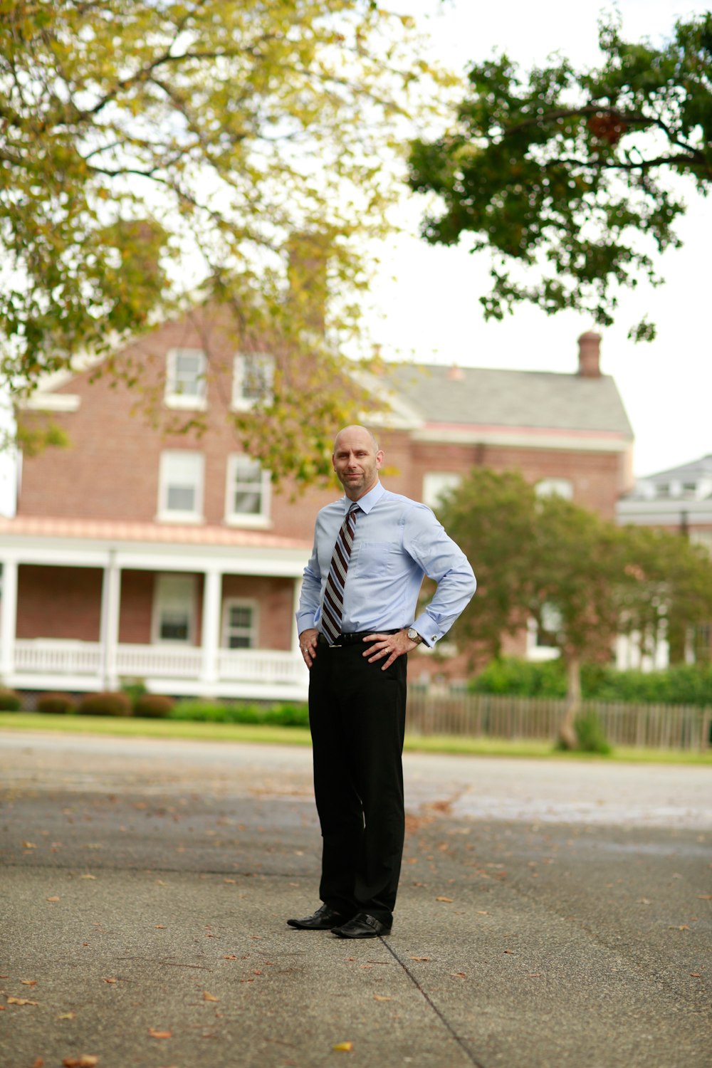 man in a white dress shirt and black dress pants