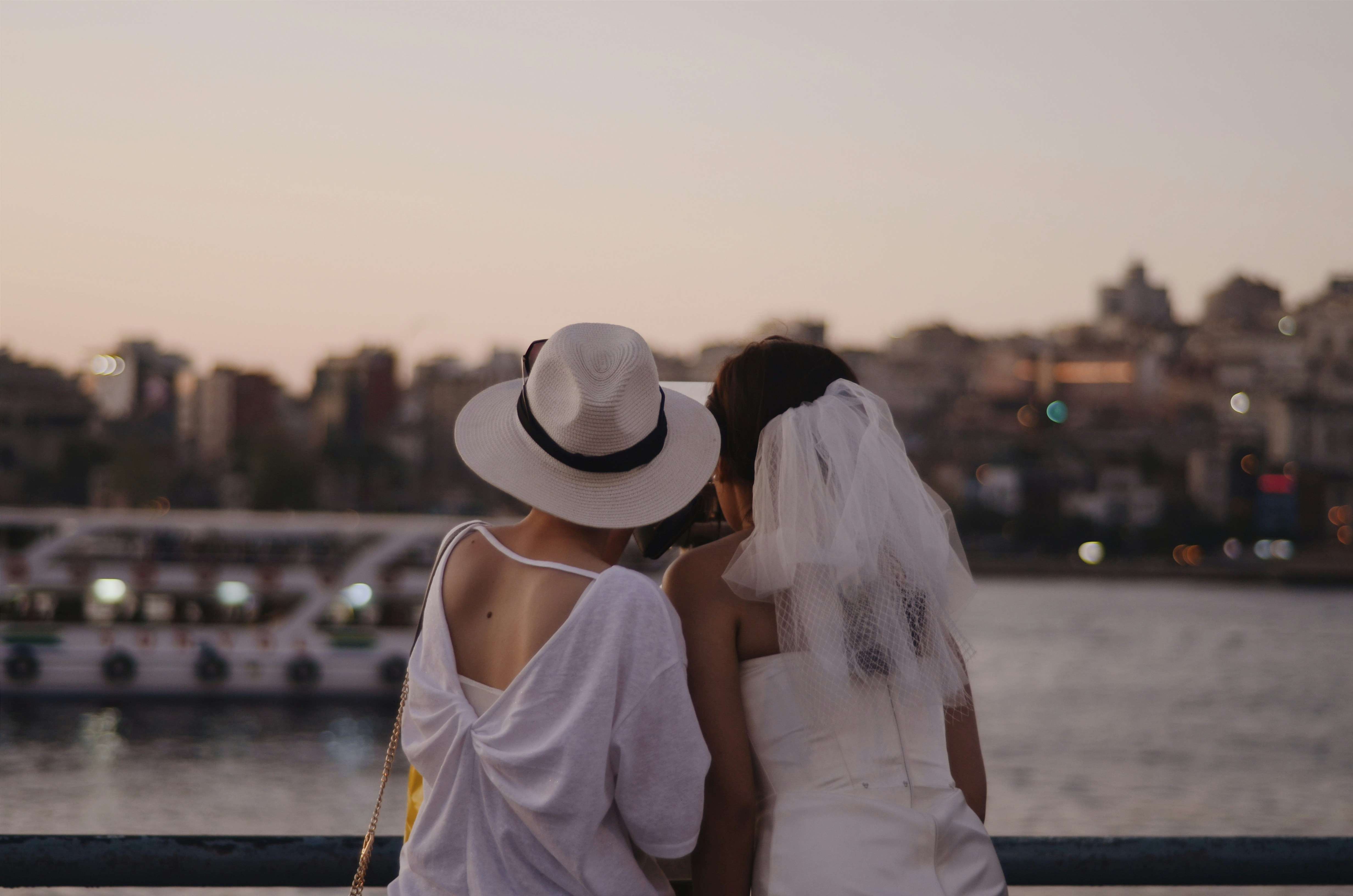 Two women in white dresses