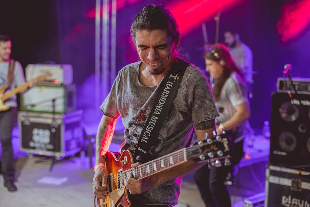 man playing electric guitar