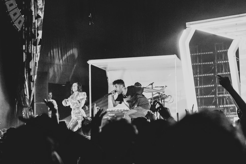 band performing on stage in front of crowd