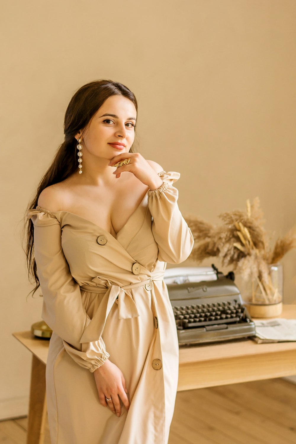 woman wearing beige dress