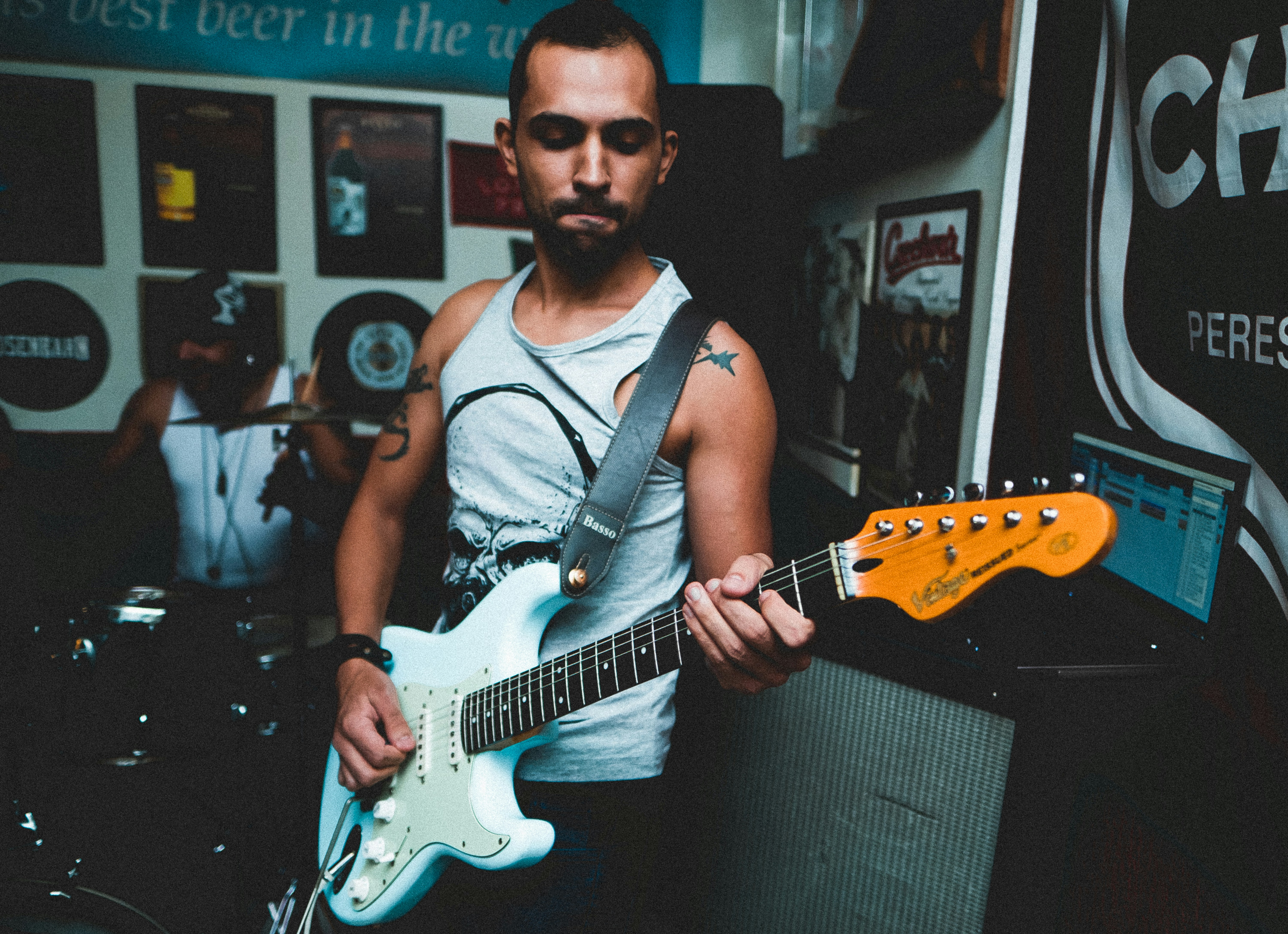 man playing an electric guitar
