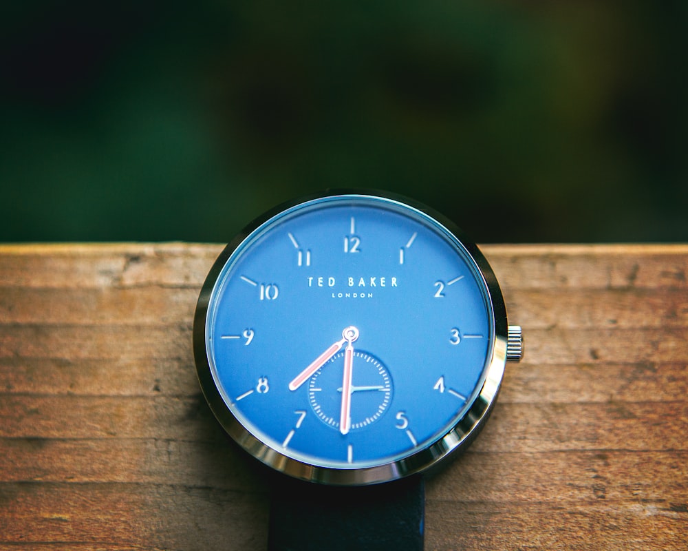 round blue Ted Baker watch at 7:31