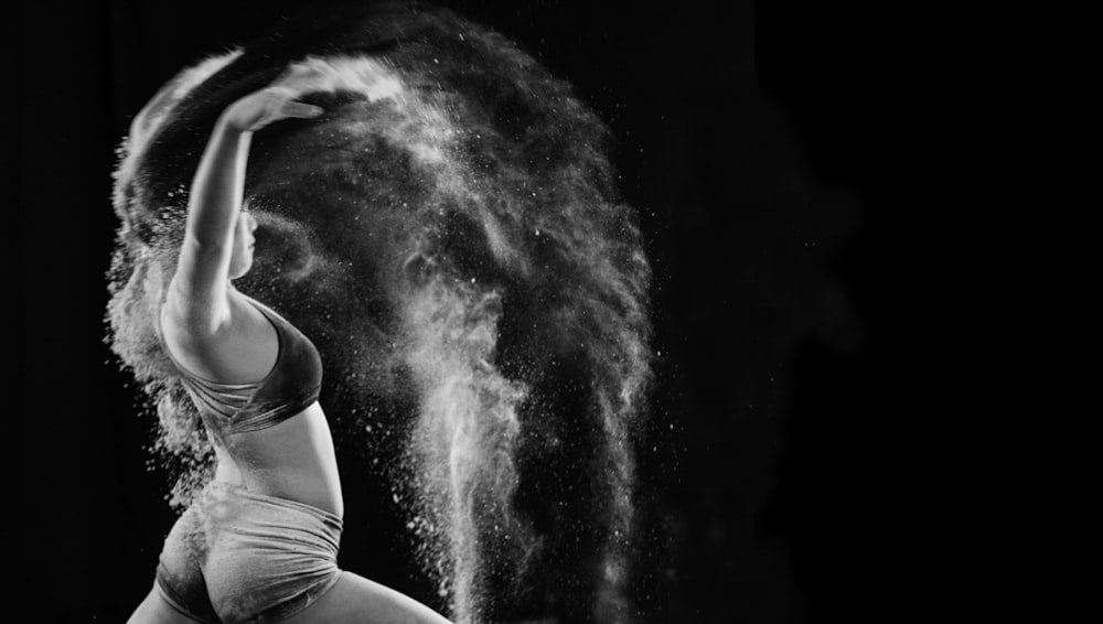 woman pouring powder