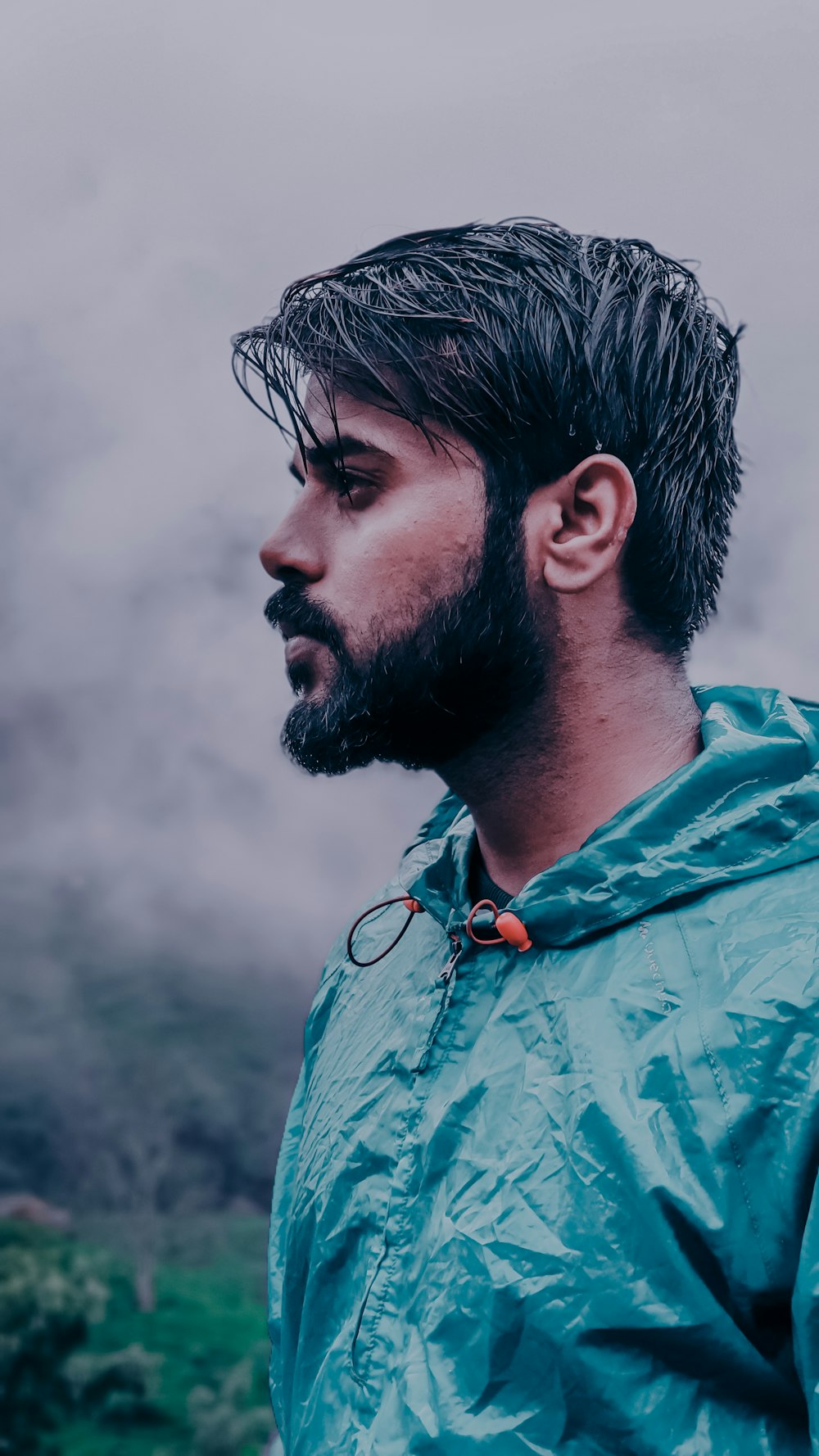 wet man wearing green hooded top