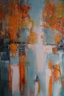 An abstract painting featuring vibrant, blurred splashes of orange and teal. The composition suggests a landscape with trees reflected on water, creating a symmetrical effect. The brush strokes are bold and textured, with areas of light creating contrast against darker tones.
