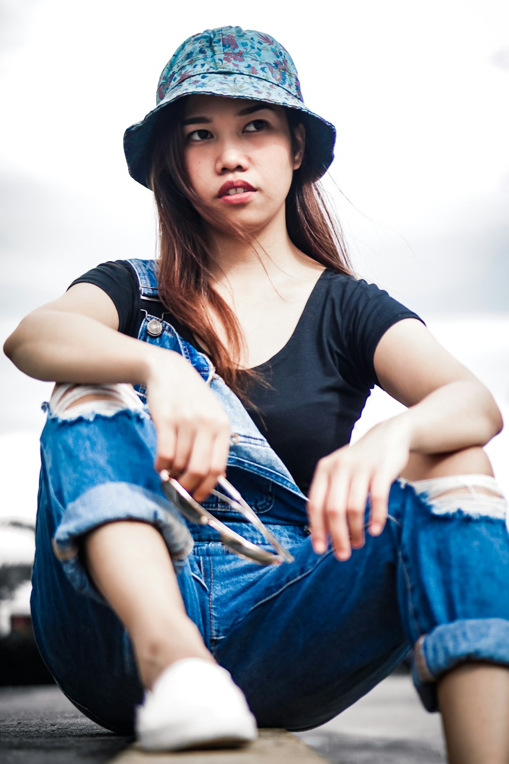 shallow focus photo of woman wearing blue bucket hat