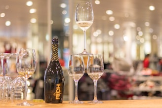 Rich añejo tequila bottle displayed with aged wood and glowing warm tones evoking deep flavor and tradition.