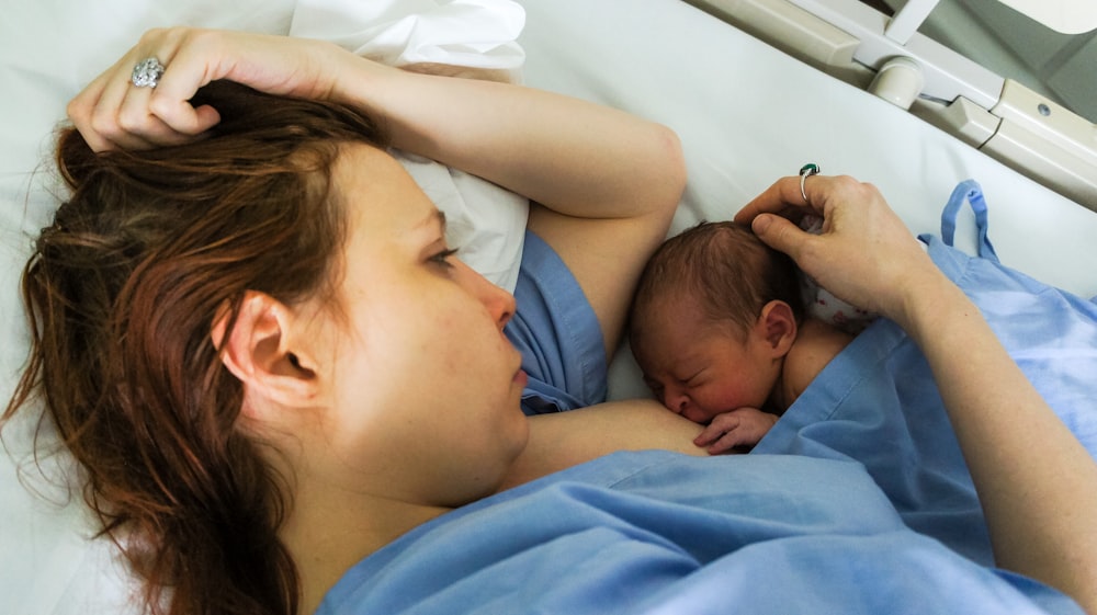 woman breastfeed the baby