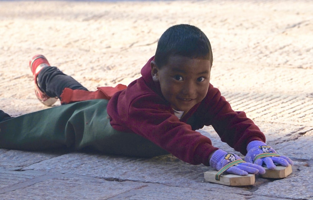 boy playing on ground