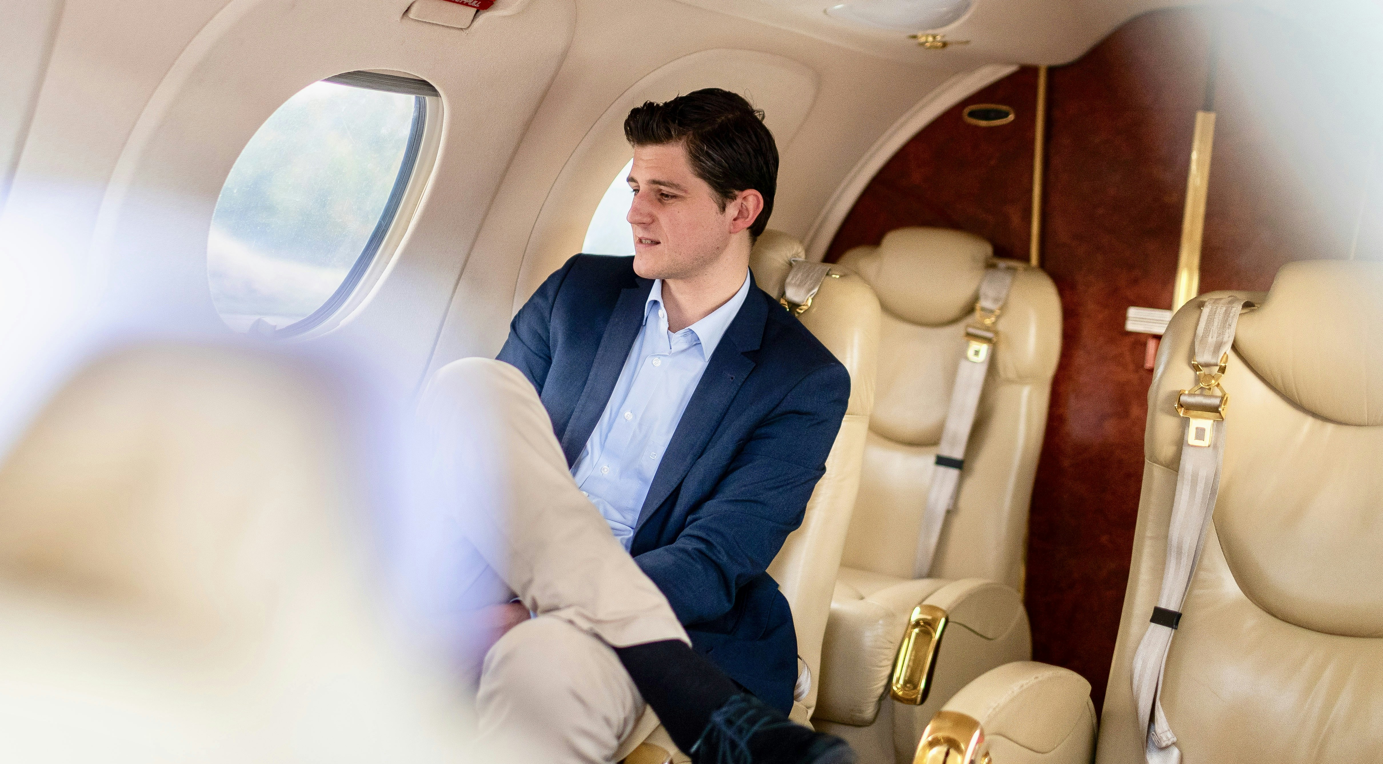 Young business man in private jet