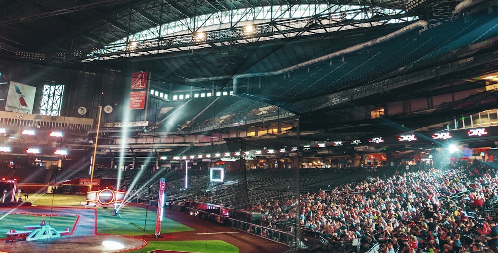 people watching sports inside stadium