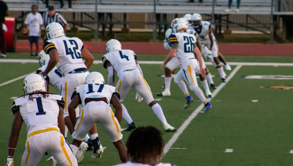 group of men playing sprint football during daytime