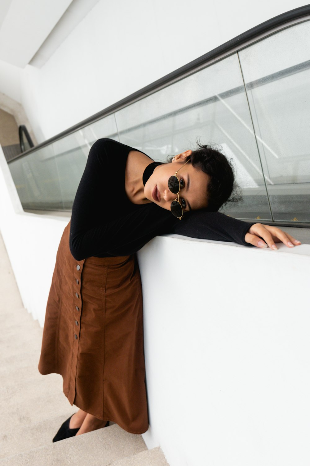 woman leaning on wall