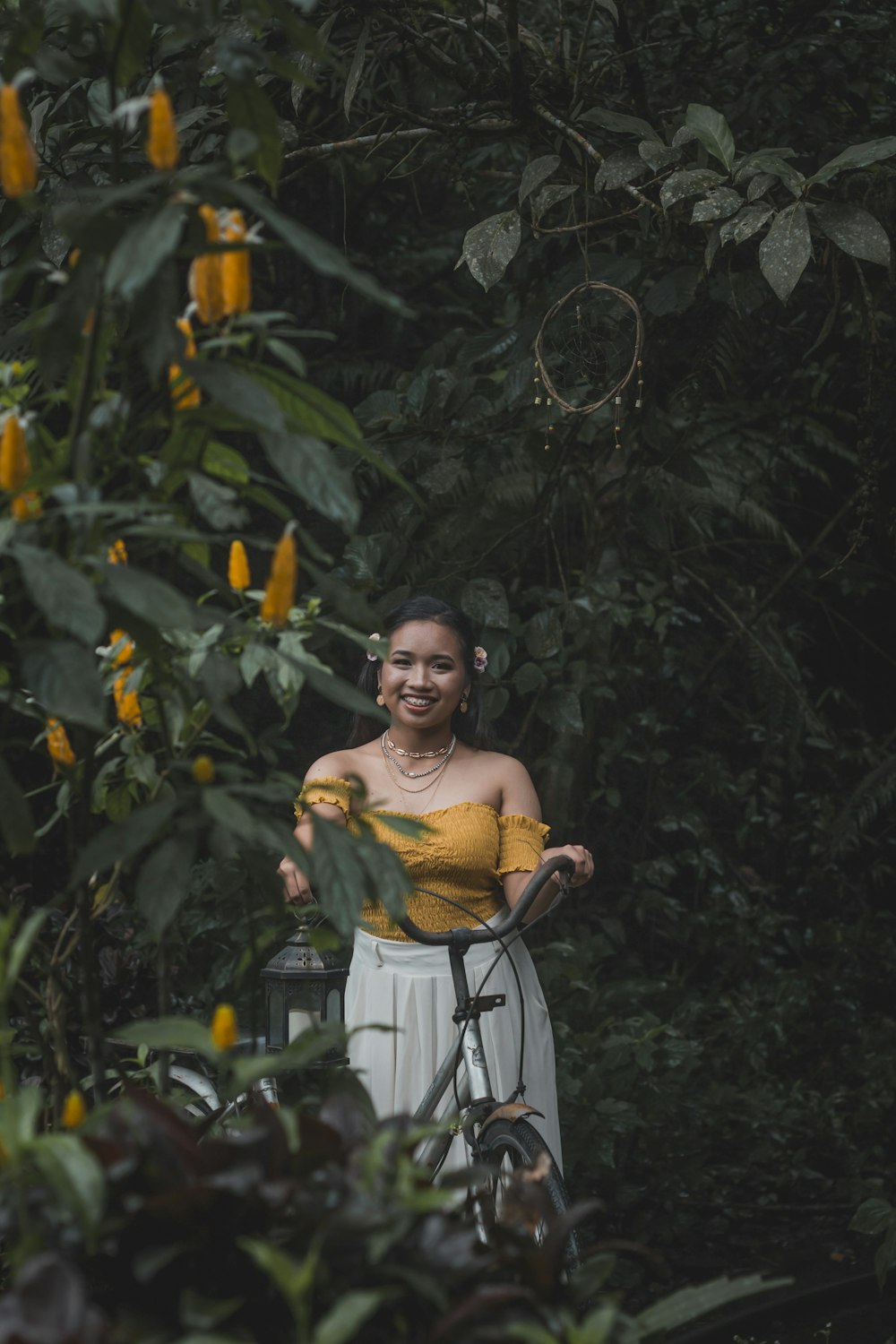 smiling woman near flower plants