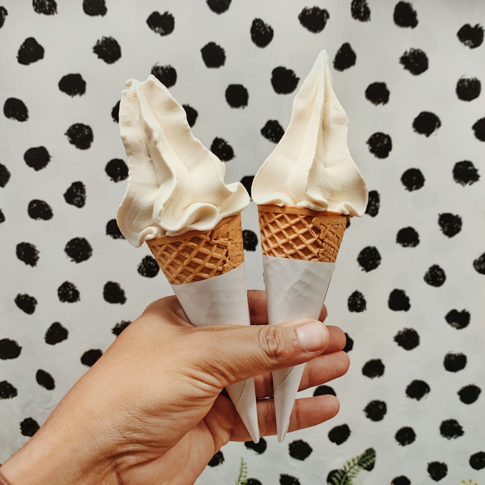 person holding ice creams