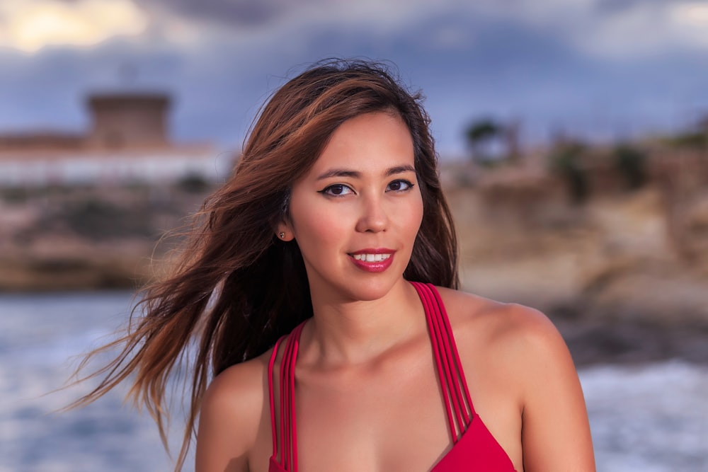 selective-focus photograph of woman in red top