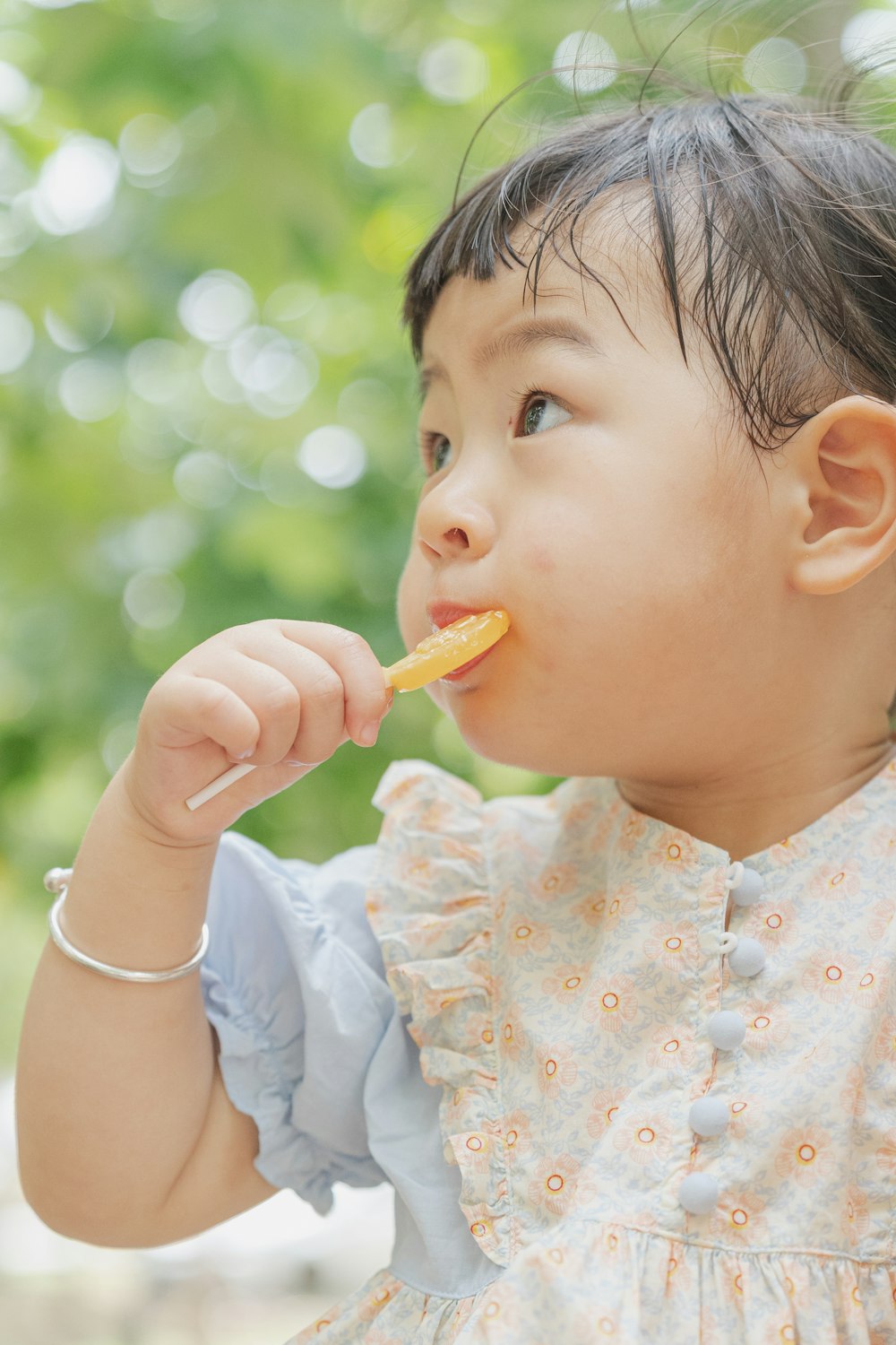 girl eating lollipop