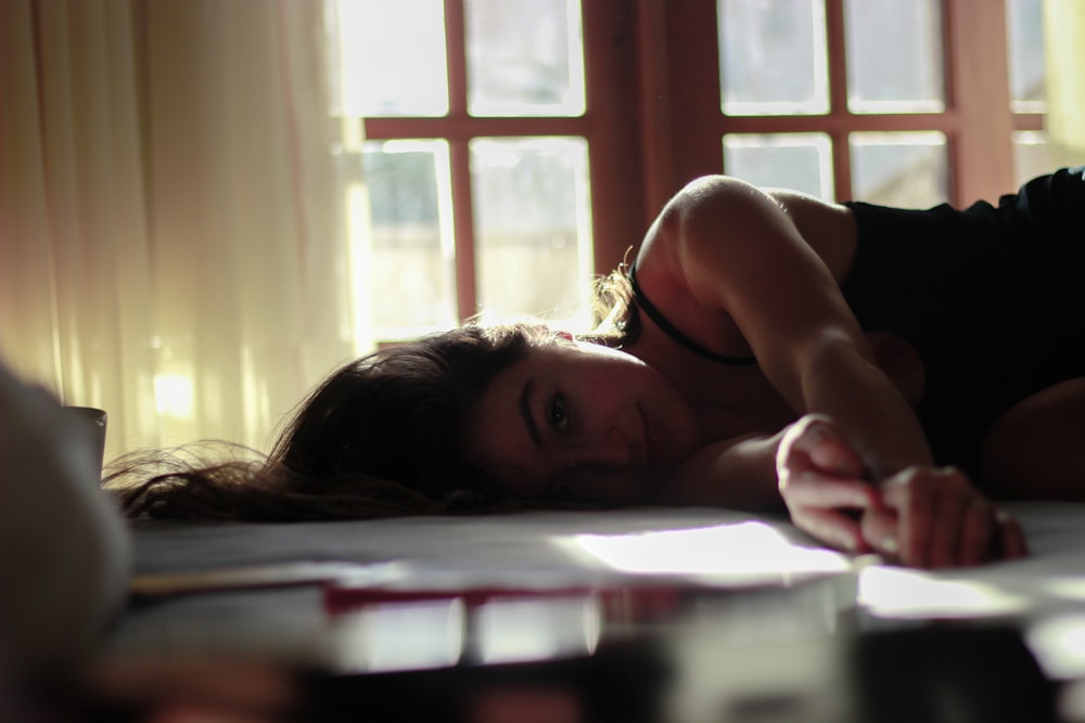 a woman laying on the floor in a room