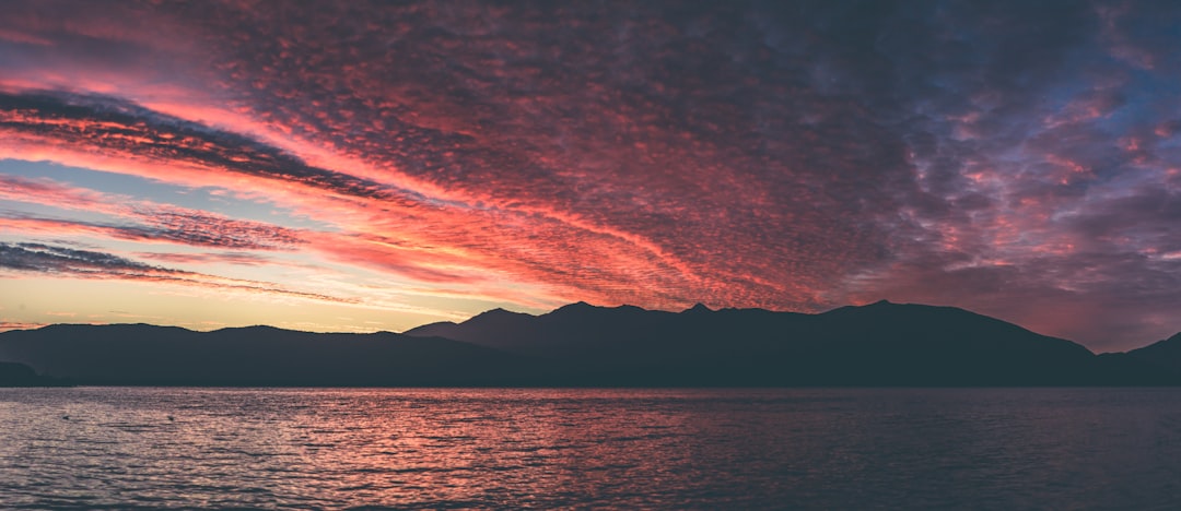 ocean and mountain during golden hour