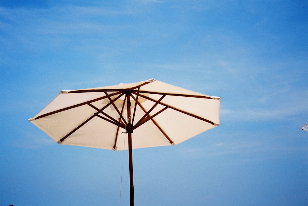 white and brown umbrella
