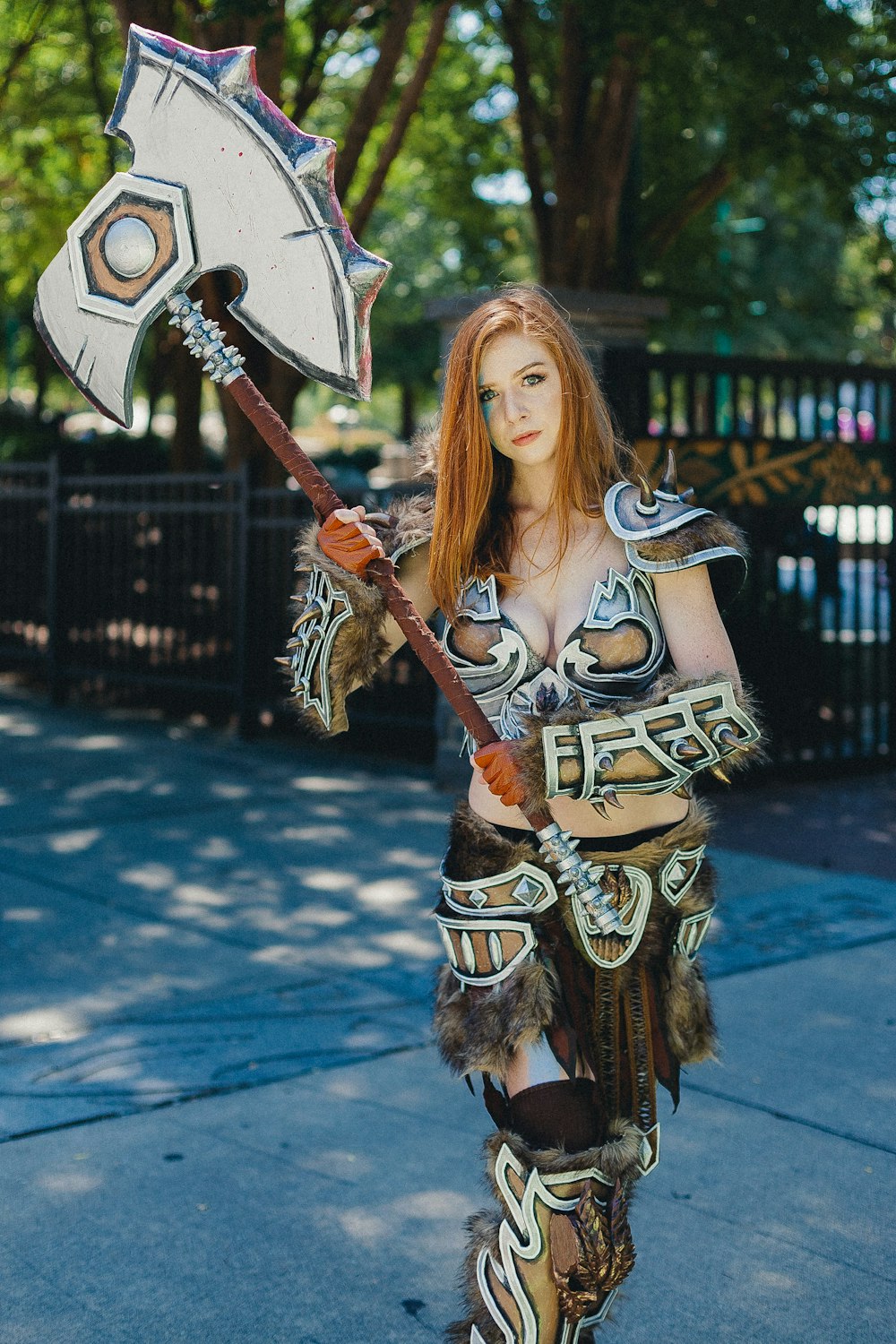 woman with cosplay costume holding swor