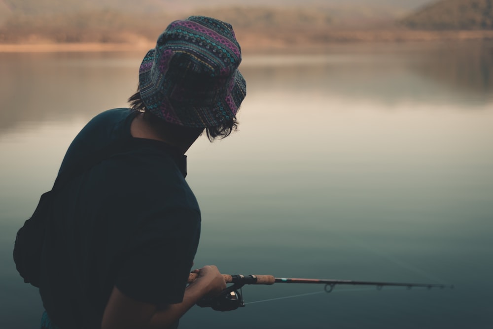 person holding fishing rod