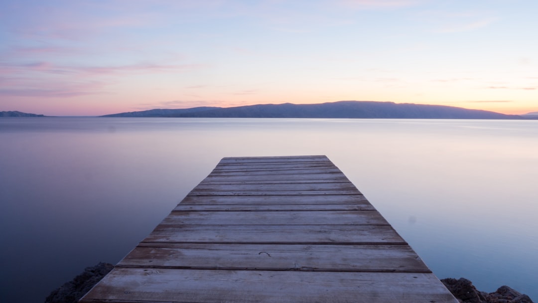 gray wooden dock during day, heaven bridge