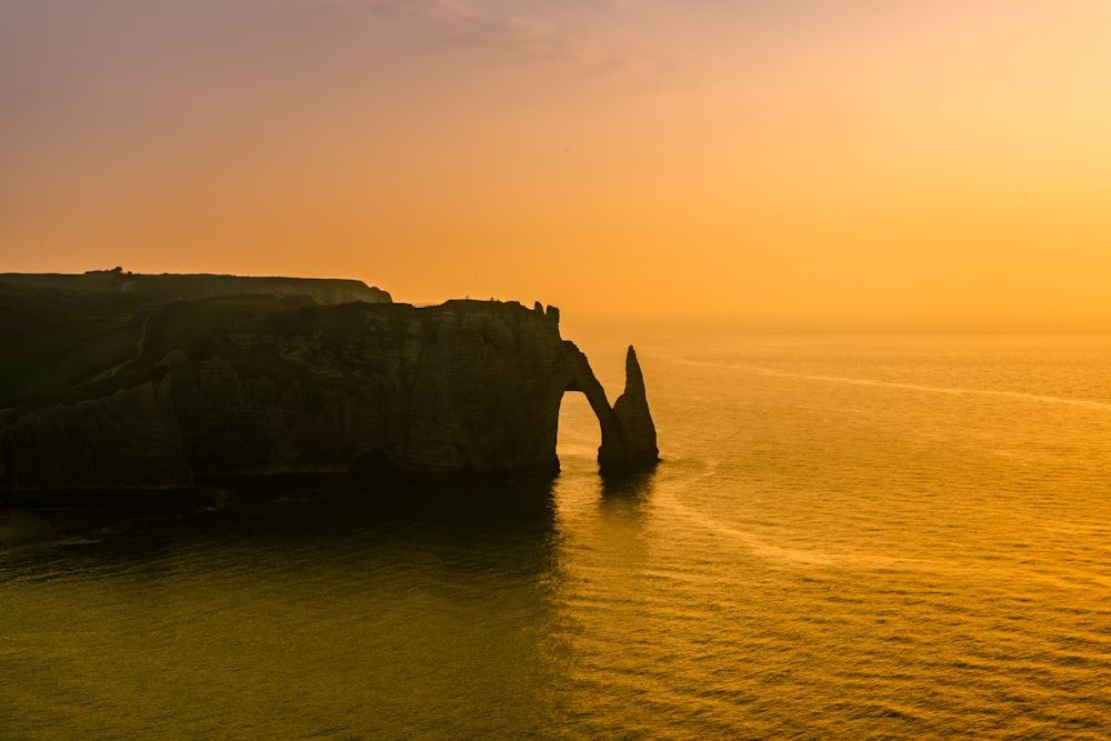 rock formation on the ocean photography