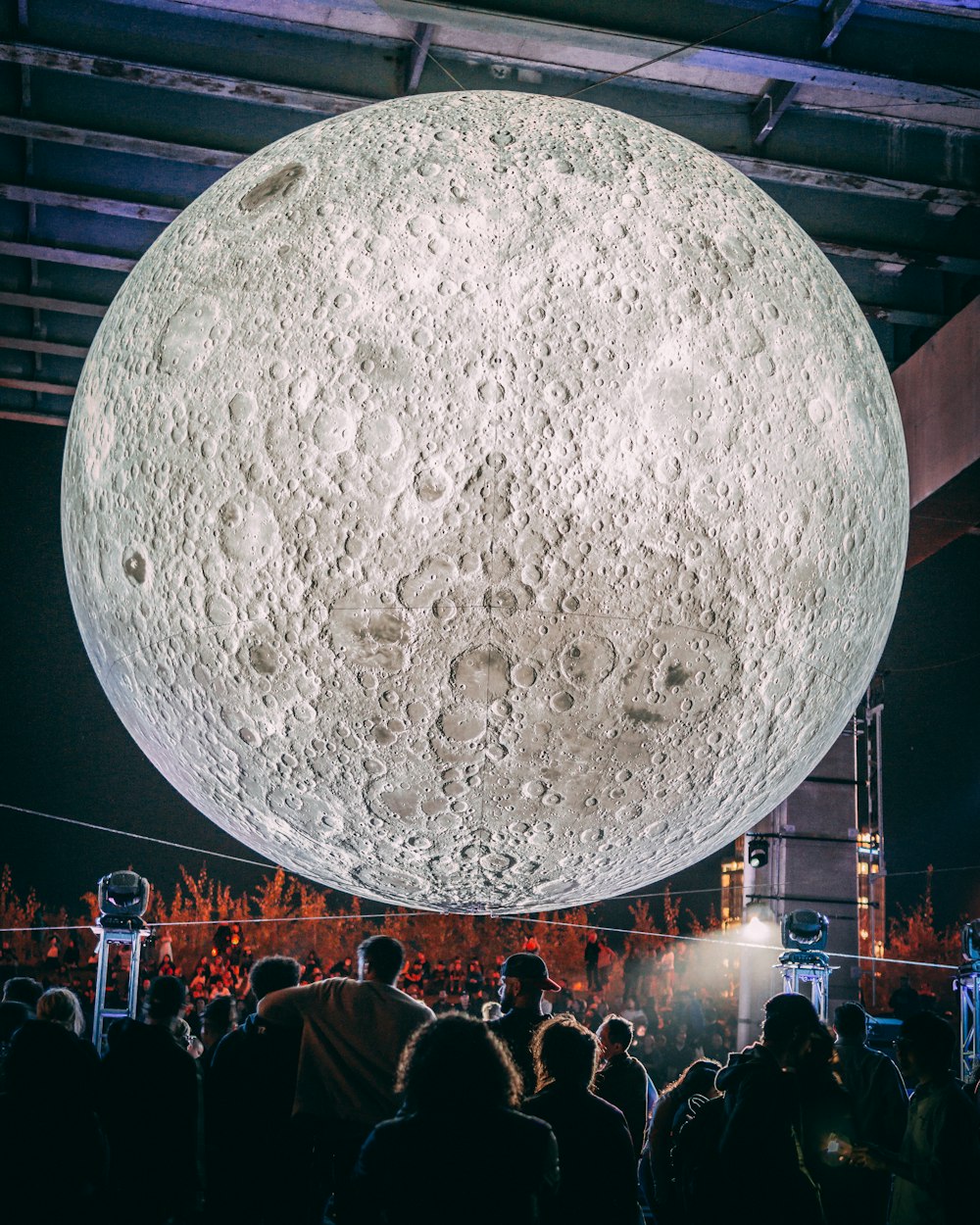 a large moon hanging from the ceiling of a building