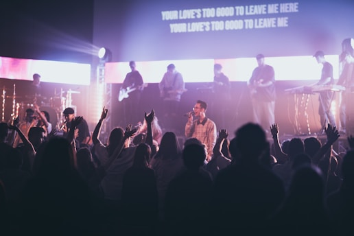 A live performance of the Karkaman band on stage.