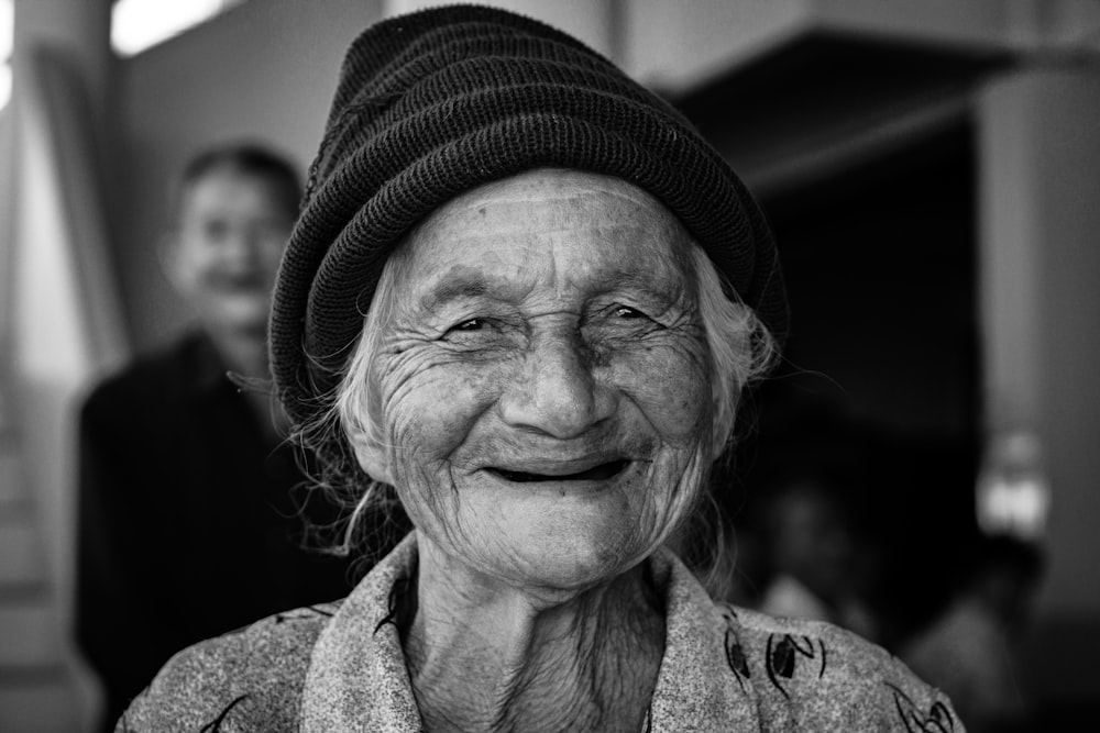 gray-scale photo of woman wearing knit cap