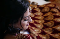 Close-up portrait of the actress in costume, showcasing intricate details.