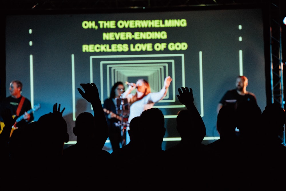 a group of people standing on top of a stage