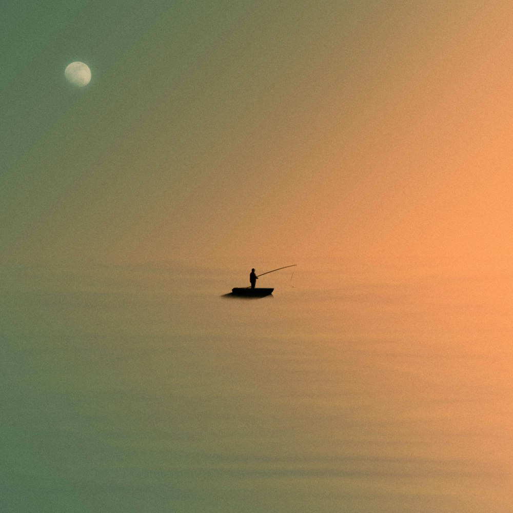 person standing in boat while fishing on body of water showing full moon