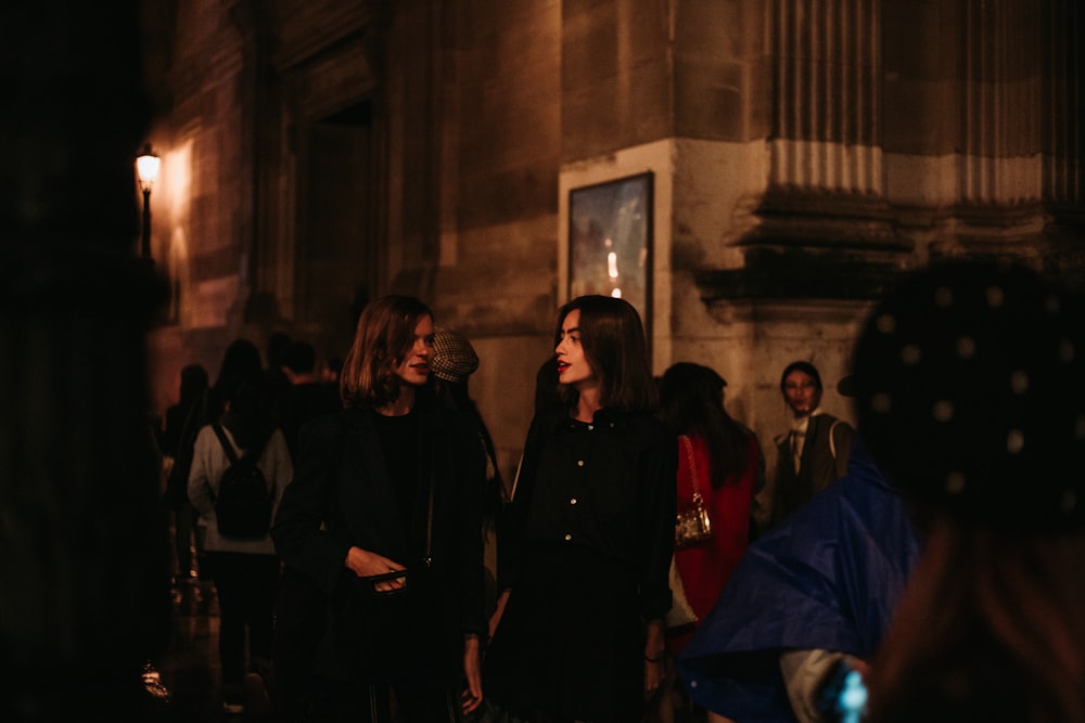 people standing near building