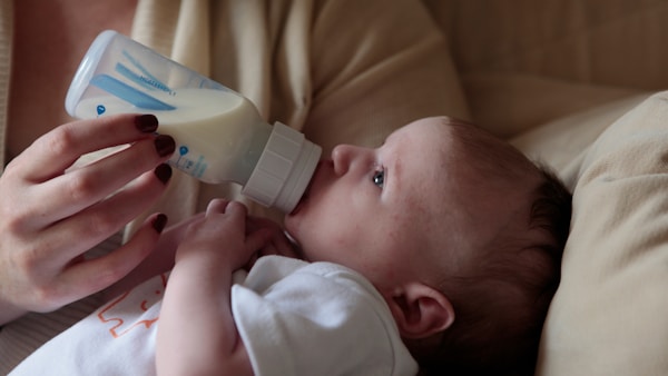 Baby feeding from a bottle